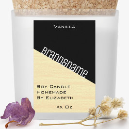 Moderne, stilvolle, pastellgelbe schwarze Kerzen i Lebensmitteletikett