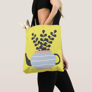 Moderne Teekanne mit Pflanze in Pastelltönen Tasche