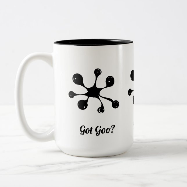 Moderner abstrakter Schwarzgoofleck Zweifarbige Tasse (Links)