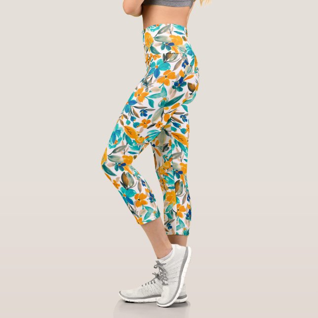 Modernes aquamarin-orangefarbenes Blumenmuster Capri Leggings (Links)