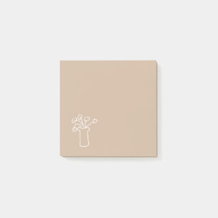 Modernes, schlichtes Schreibgerät mit weißer Blume Post-it Klebezettel