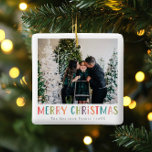 Modernes und farbenfrohe Weihnachtsfamilien Foto Keramikornament<br><div class="desc">Diese schlichte und lustige Familie Frohe Weihnachtsschmuck bietet Ihnen einen Ort, um Ihre Namen hinzuzufügen, mit "Frohe Weihnachten" in bunten, leuchtenden Typografie, sowie Raum für Sie, um Ihr eigenes Foto hinzuzufügen. Auf der Rückseite ist ein passendes farbiges Polka Dot Design. Die perfekte moderne Weihnachtsdekoration für Ihre Familie in diesem Winter!...</div>