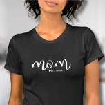 Mom Established New Mom Gift T-Shirt<br><div class="desc">Simple Script Mom Personalized Shirt. Celebrate motherhood with this minimalist design featuring the word “mom” in a flowing handwritten script font across the front in white on a black shirt. At the bottom right, a classic serif “est. year” adds a personal touch—perfect for a mom-to-be, a new mom, or to...</div>
