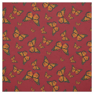 Monarch Butterfly-Muster auf dunkelrotem Hintergru Stoff