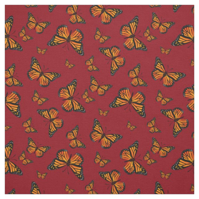 Monarch Butterfly-Muster auf dunkelrotem Hintergru Stoff (Muster)
