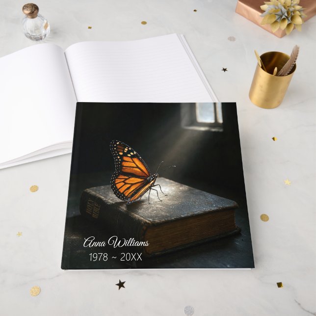 Monarchschmetterling auf einer Heiligen Bibel Gästebuch (Vorderseite offen)