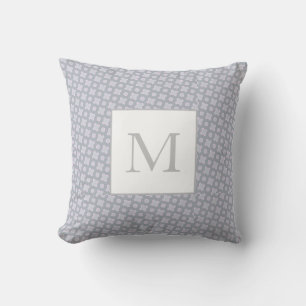 Monogramm auf einem geometrischen Muster rosa und Kissen