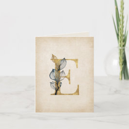 Monogramm aus Gold und Schwarz mit Blätter