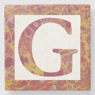 Monogramm G aus rotem und gelbem Stein Steinuntersetzer