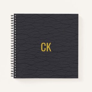 Monogramm-Initialen des modernen schwarzen Ledermu Notizbuch