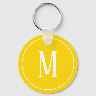 Monogramm-Weiß auf goldenem gelbem Schlüsselanhänger