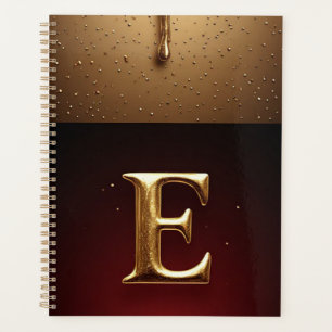 Monogramme de lettre E dorée avec métal qui coule
