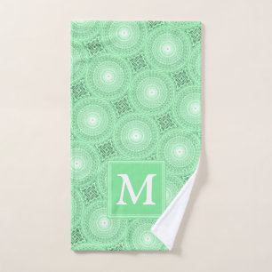 Monogramme vert ressort cercles motif