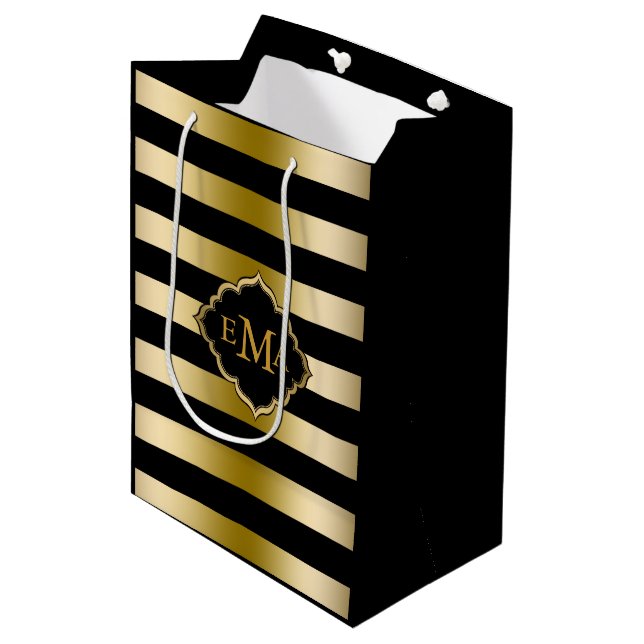 Monogrammiertes Muster aus Gold und schwarzen Stre Mittlere Geschenktüte (Vorderseite Schrägansicht)