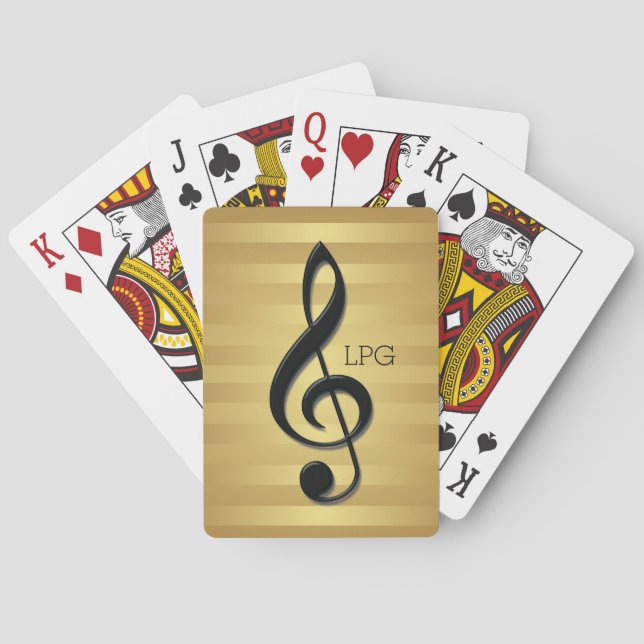 Monogrammschwarzer dreifacher Clef auf goldenen Spielkarten (Rückseite)