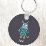 Monster Sidney Individuelle Name Schlüsselanhänger<br><div class="desc">Ein niedliches kleines Monster,  ideal für ein Gastgeschenk mit Themen,  zu Halloween oder zu jedem anderen Tag! Personalisieren Sie das Programm,  indem Sie den Namen ändern oder entfernen.</div>