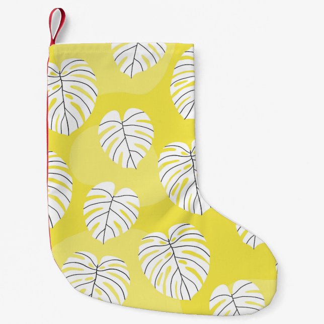 Monstera Blätter, hellgelber Hintergrund. Kleiner Weihnachtsstrumpf (Vorderseite)