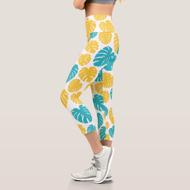 Monstera-Blätter in Türkis, Gelb und Weiß Capri Leggings (Links)
