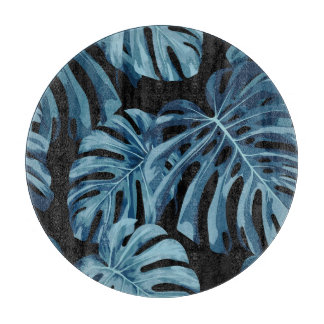 Monstera Pflanze: blaues Blätter Muster. Schneidebrett