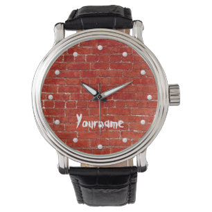 Montre Le graffiti rouge de mur de briques ajoutent votre
