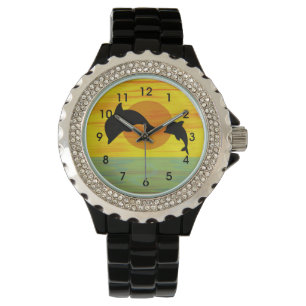 Montre Mère et bébé dauphin au coucher du soleil