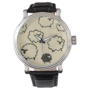 Montre Moutons blancs et noirs sur l'arrière - plan crème