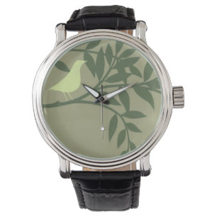 Montre Oiseau vert perché sur une branche verte