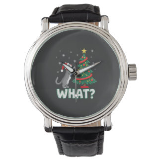 Montre Quel chat drôle poussant l'arbre de Noël par-dessu