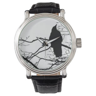 Montre Raven - poète sur une branche d'arbre