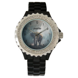 Montre Un éléphant asiatique dans un défrichement éclairé