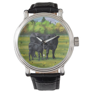 Montre Vache d'Angus noir et veau mou en pâturage d'été