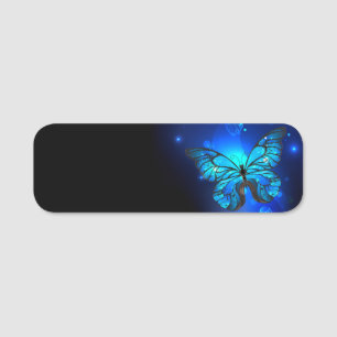 Morpho Butterfly im dunklen Hintergrund Namensschild