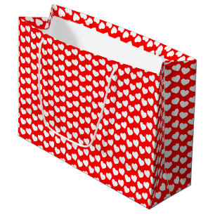 Motif blanc de coeur sur le grand sac rouge de