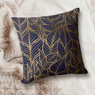 Motif de feuille d'or sur oreiller à jet bleu