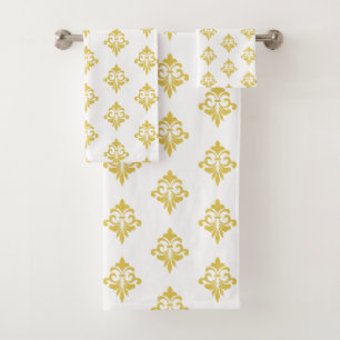 Motif élégant de fleur de lis dorée sur fond blanc