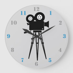MOVIE CAMERA AND TRIPOD WITH GRAY AND BLUE NUMBERS GROßE WANDUHR