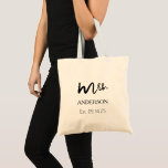 Mrs Black Modern Script Custom Wedding Newlywed Tragetasche<br><div class="desc">This is Modern and casual chic black calligraphy script "Mrs." women's wedding tote bag. This tote bag feature is custom text. You can be personalized with the bride's new married last name and wedding date. It is perfect accessory for the honeymoon and beyond!</div>