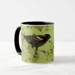 Mug arrière - plan vert d'oiseau noir à ailes rouges