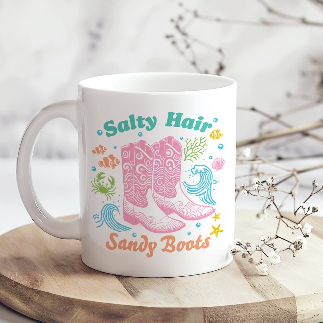 Mug "Botte de sable à cheveux salés" Boho Coastal Cowg ("Salty Hair Sandy Boots" Boho Coastal Cowgirl Coffee Mug on a boho kitchen table with tiny flowers)