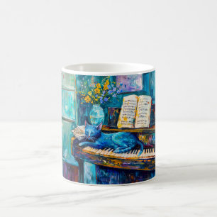 Mug Chat dort sur le piano