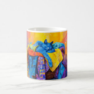 Mug Chat endormi dans un tas de linge
