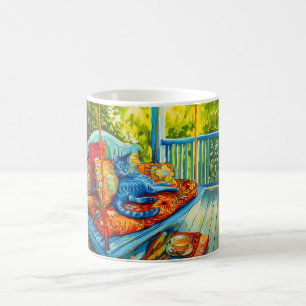 Mug Chat se toilette sur une balançoire
