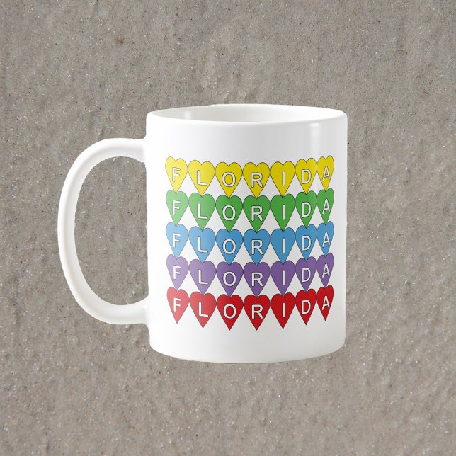 Mug Florida Rainbow Hearts (A mug that says Florida in red, yellow, green, blue & purple hearts.)