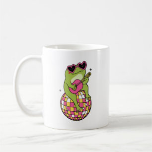 Mug Grenouille assise sur un ballon de danse jouant de