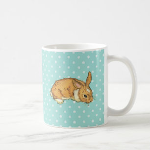 Mug lapin de bébé sur l'arrière - plan turquoise de
