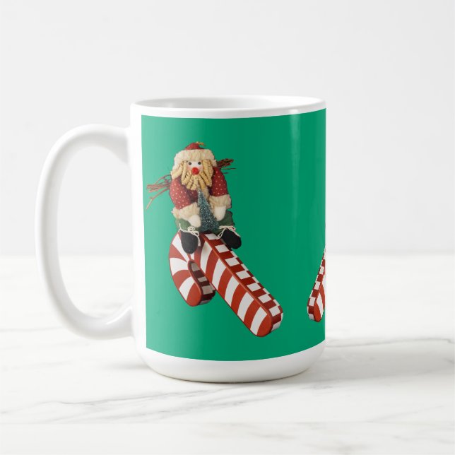 Mug Santa Clause rides candy cane slide for Christmas. (Gauche)