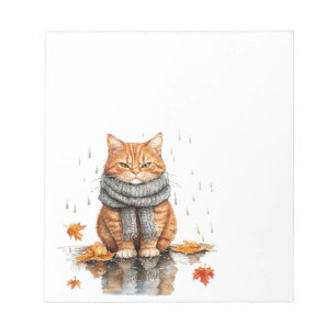 Mürrische orange Katze im Regen Notizblock