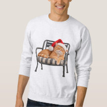 Mürrische rote Katze mit Santa-Hut Weihnachtshumor