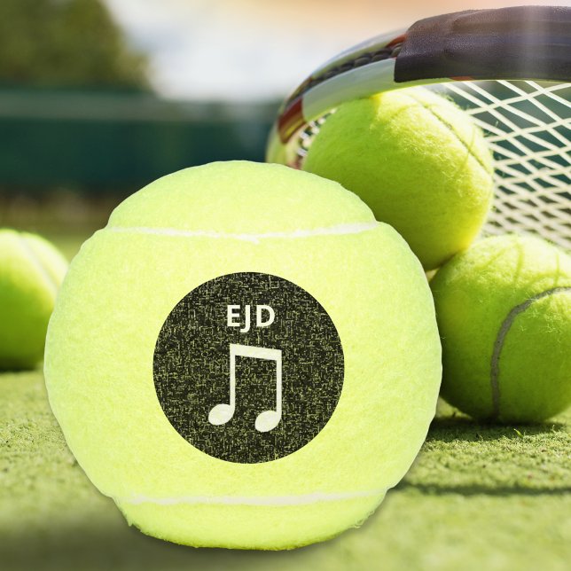 Musikalische Note Mit Monogramm Music Lovers Tenni Tennisbälle (A monogrammed tennis ball with musical notes design on a black circle)