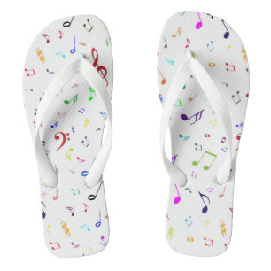 Musikalische Symbole in den Regenbogen-Farben Flip Flops